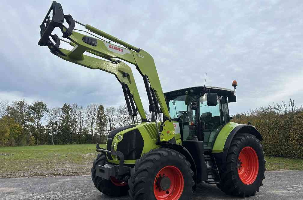 Claas Arion 640 cis, lucht, frontlader - Tractor: foto 1 Claas Arion 640 cis, lucht, frontlader - Tractor: foto 1