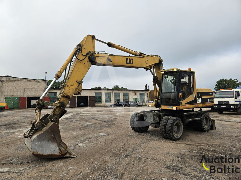 Caterpillar M 318 C - Excavadora de ruedas: foto 1 Caterpillar M 318 C - Excavadora de ruedas: foto 1