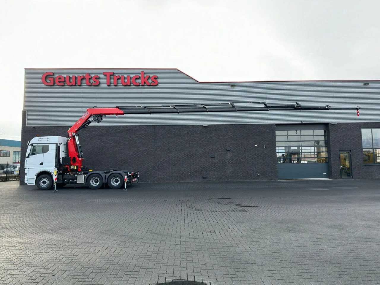MAN TGX 33.520 6X4 TREKKER-BAKWAGEN COMBI + FASSI F4 - Camión grúa: foto 1 MAN TGX 33.520 6X4 TREKKER-BAKWAGEN COMBI + FASSI F4 - Camión grúa: foto 1