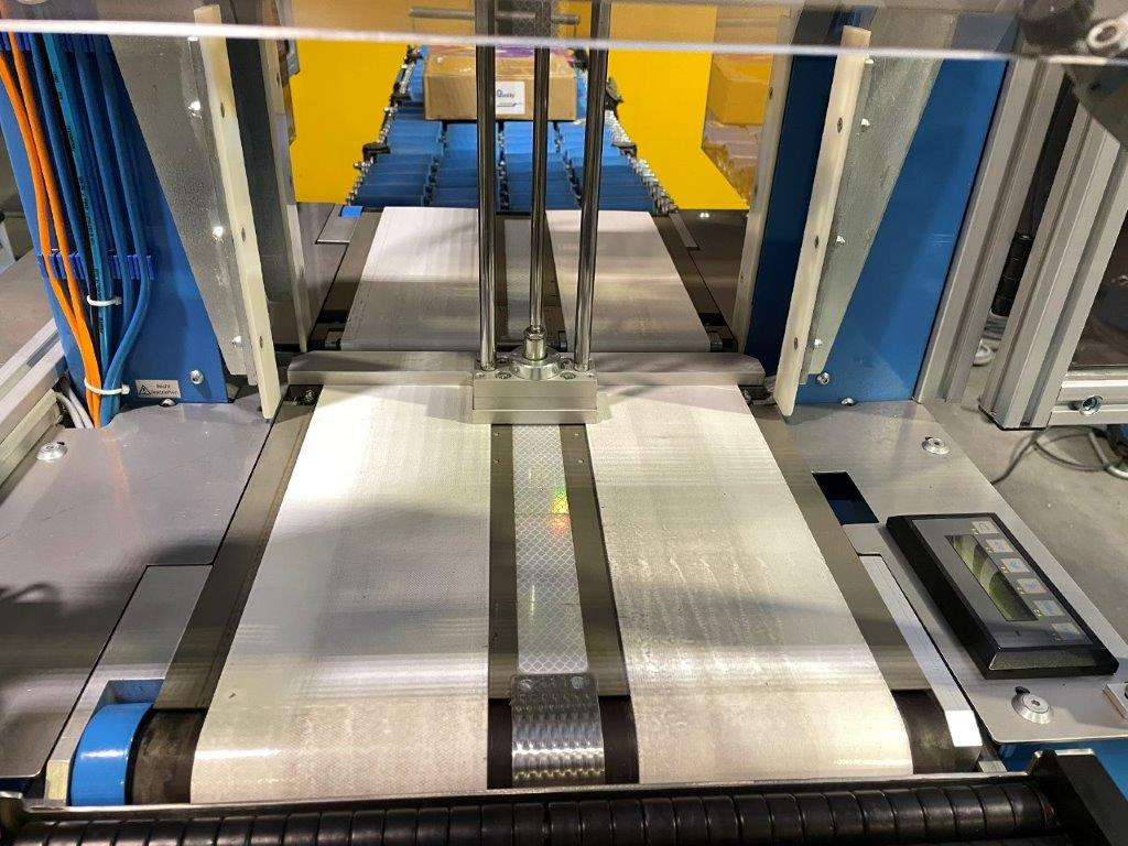 ATS Tanner UltraSonic US 2000-AB transit banding machine with pneumatic product hold-down and infeed roller table - Máquina de embalaje: foto 5 ATS Tanner UltraSonic US 2000-AB transit banding machine with pneumatic product hold-down and infeed roller table - Máquina de embalaje: foto 5