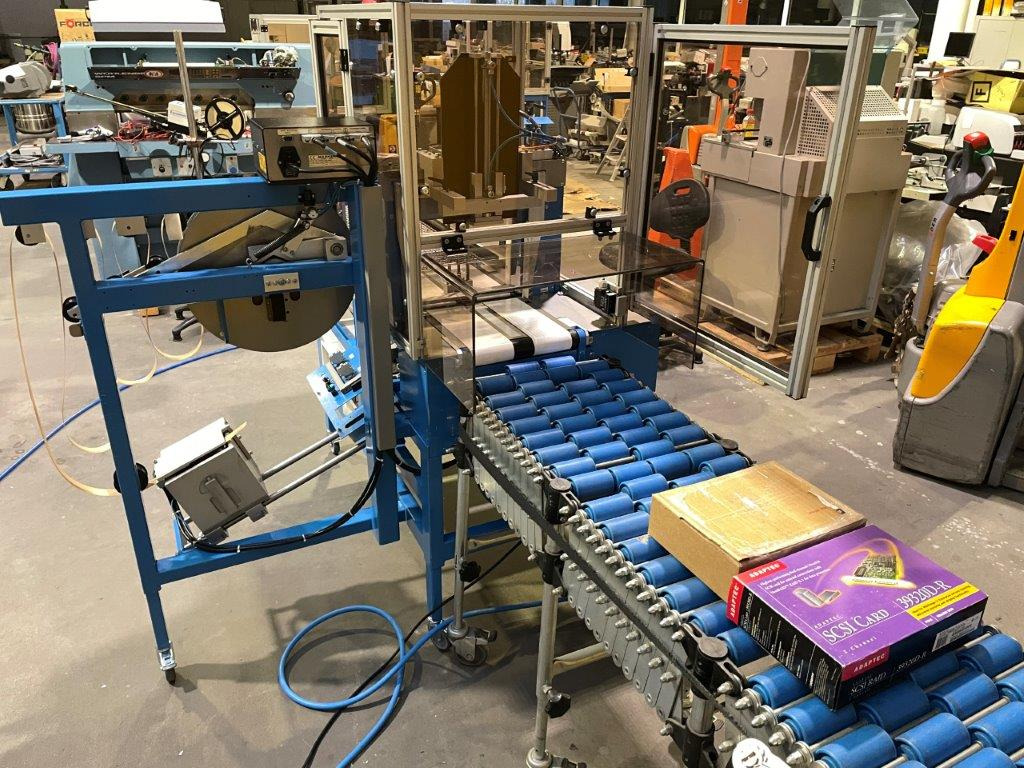 ATS Tanner UltraSonic US 2000-AB transit banding machine with pneumatic product hold-down and infeed roller table - Máquina de embalaje: foto 1 ATS Tanner UltraSonic US 2000-AB transit banding machine with pneumatic product hold-down and infeed roller table - Máquina de embalaje: foto 1