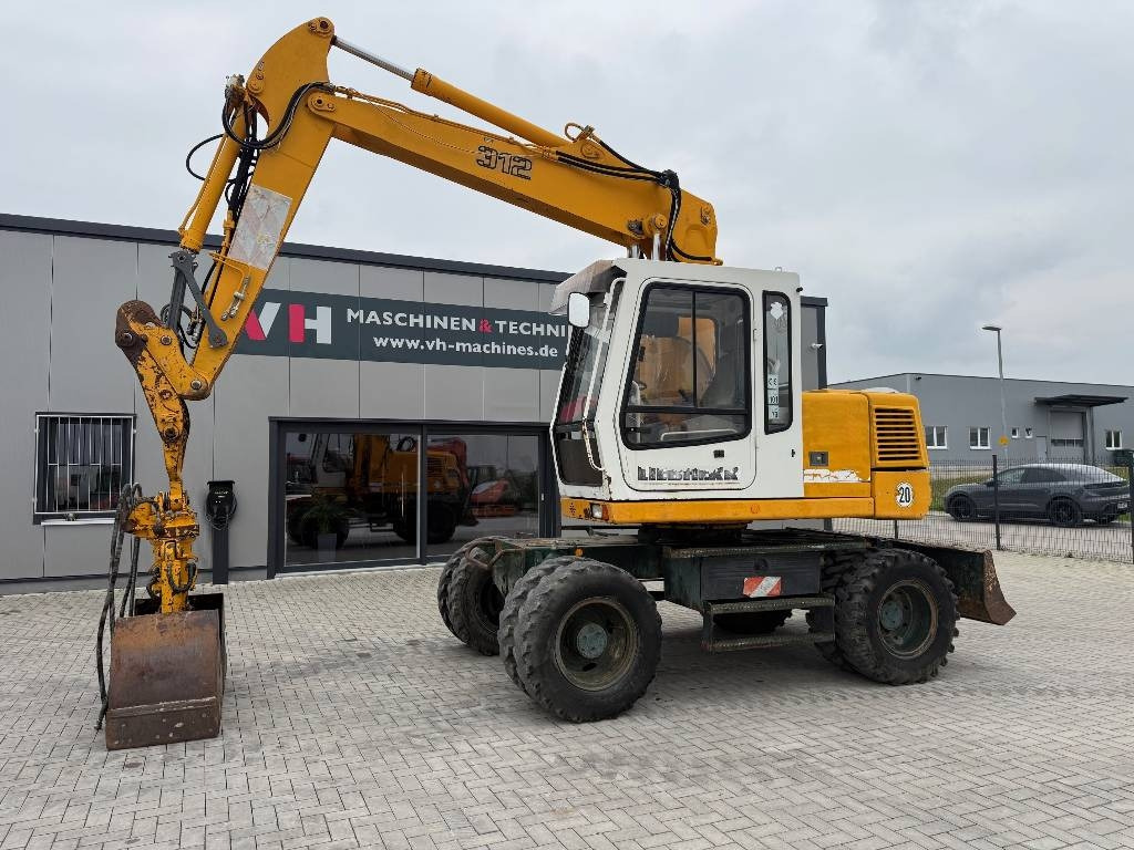 Liebherr A 312 - Excavadora de ruedas: foto 1 Liebherr A 312 - Excavadora de ruedas: foto 1