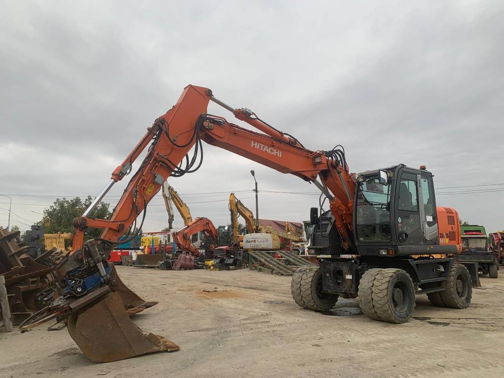 Hitachi ZX 145 W-3+SMP Rototilt - Excavadora de ruedas: foto 1 Hitachi ZX 145 W-3+SMP Rototilt - Excavadora de ruedas: foto 1