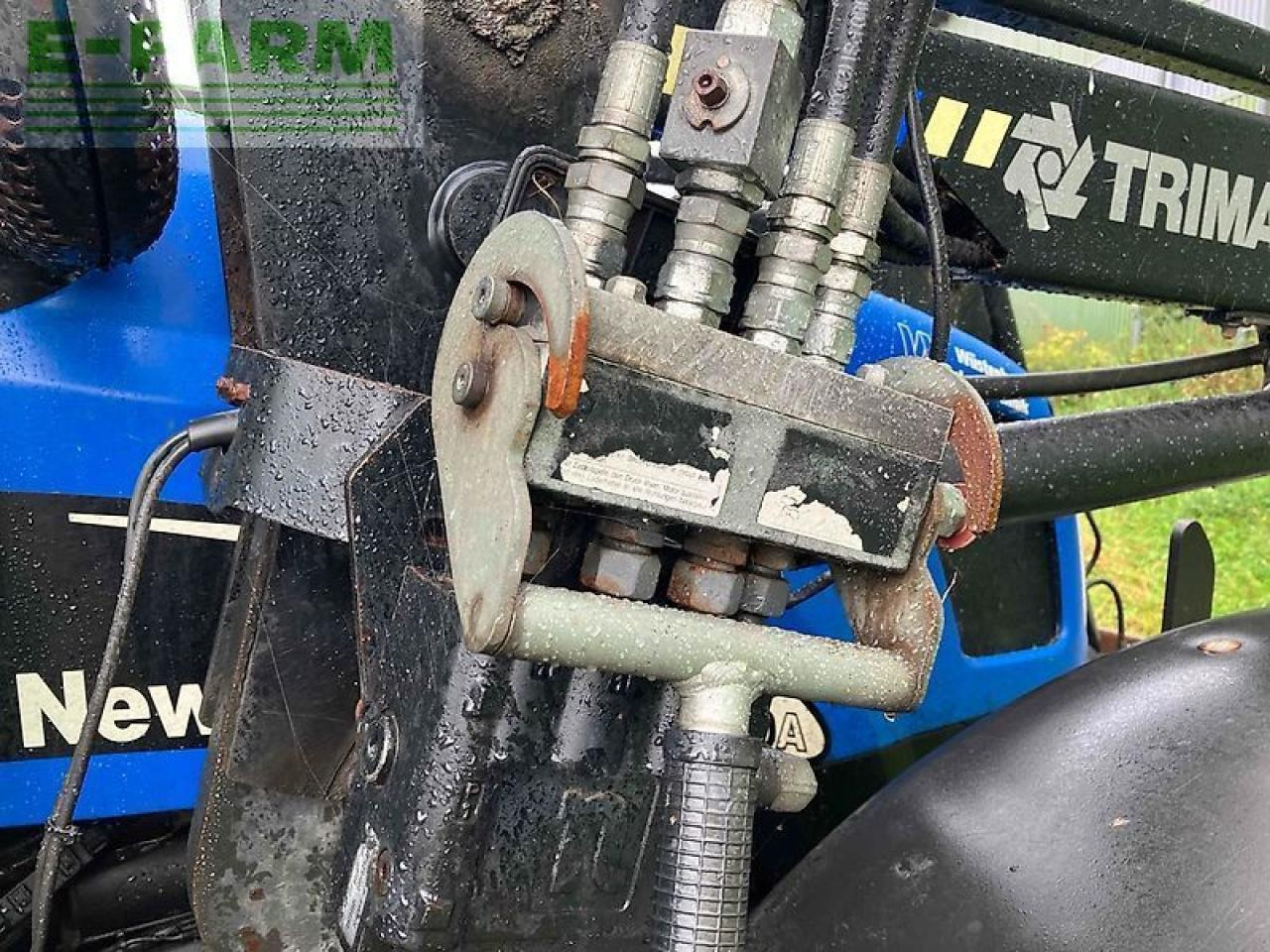 New Holland tl 100 a A - Tractor: foto 5 New Holland tl 100 a A - Tractor: foto 5