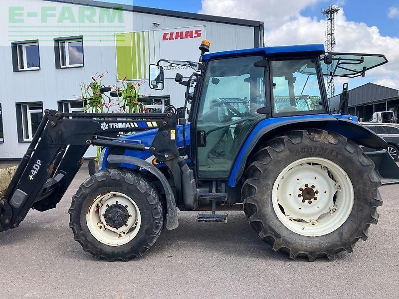 New Holland tl 100 a A - Tractor: foto 1 New Holland tl 100 a A - Tractor: foto 1