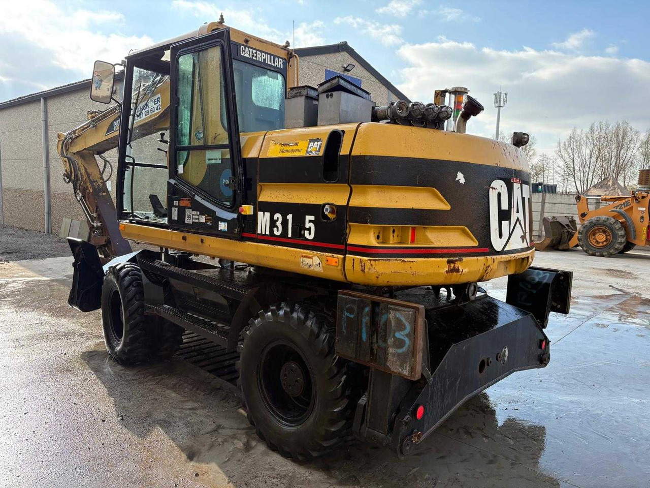 Caterpillar M315 - Excavadora de ruedas: foto 2 Caterpillar M315 - Excavadora de ruedas: foto 2